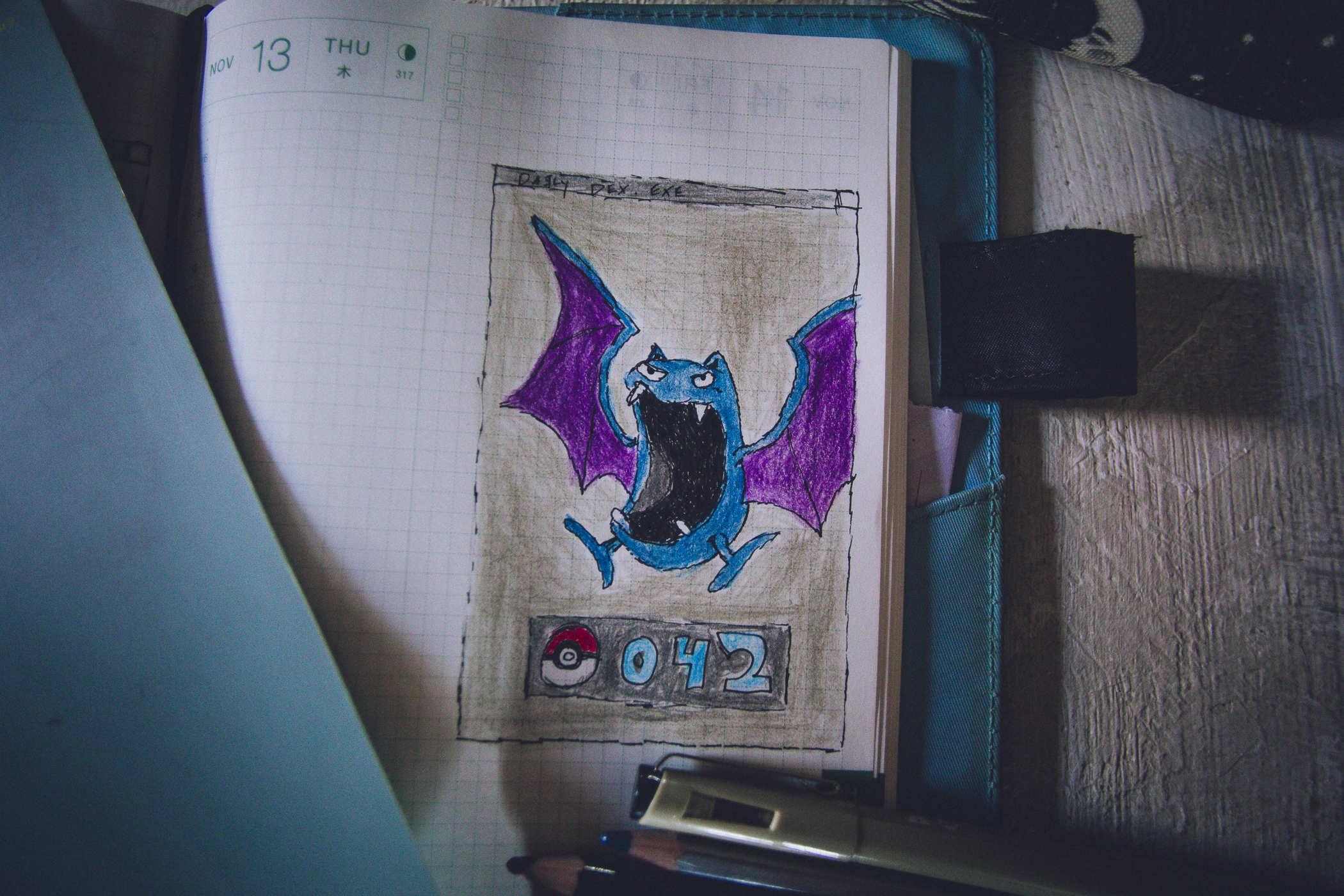 Hand drawn Pokemon 042 - the Golbat which is a large blueish bat with purple wings and a comically large mouth