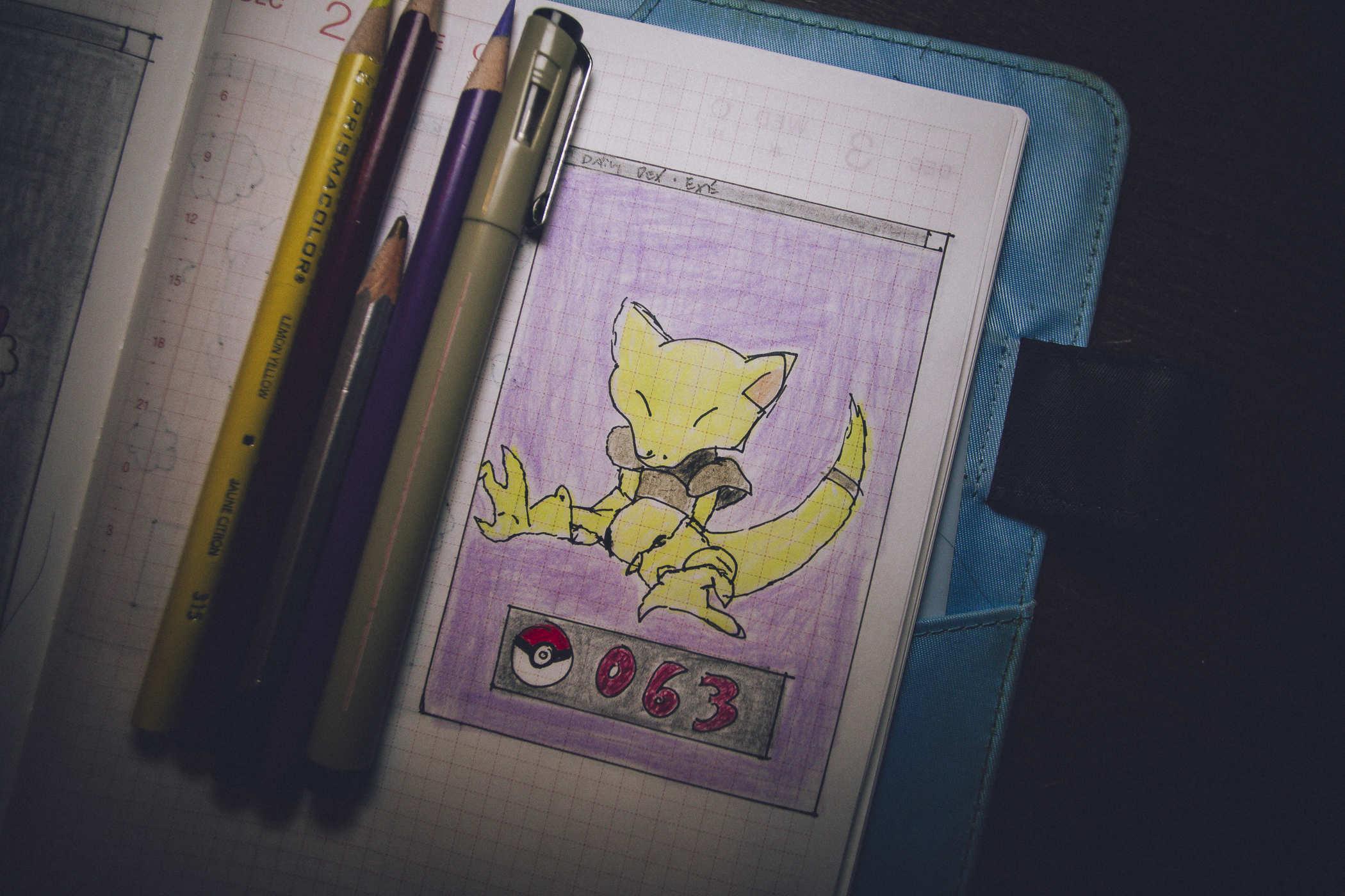 Drawing of Pokemon 63 - a yellow reptilian like alien creature that's asleep