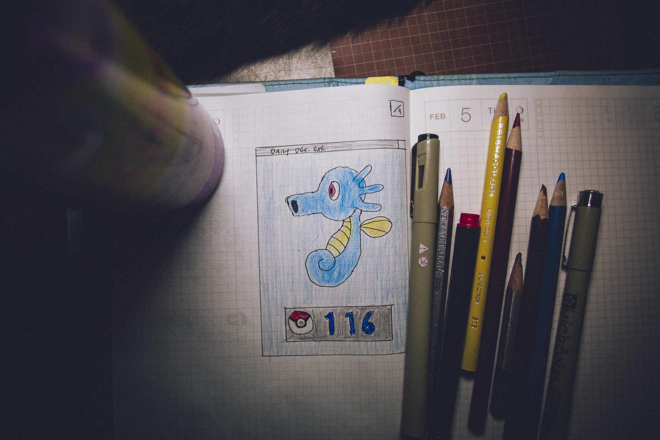 Drawing of pokemon 116; a blueish seahorse