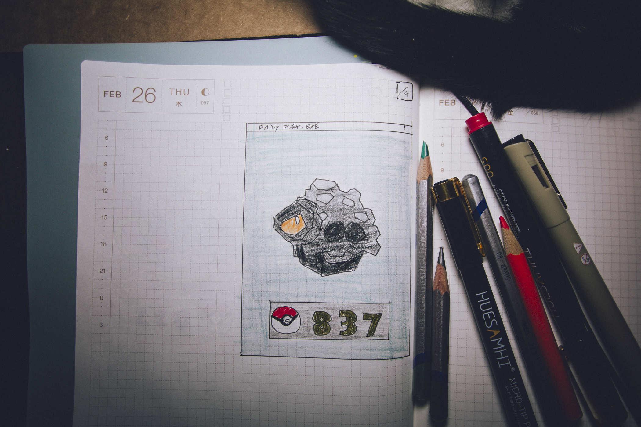 Drawing of pokemon 837; it's a lump of coal with an orange eye at the center