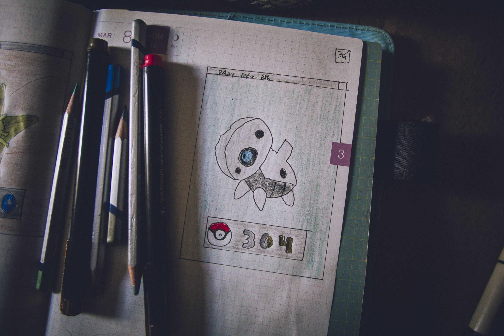 Drawing of pokemon 304; a small bone-colored dog-looking thing with blue eyes