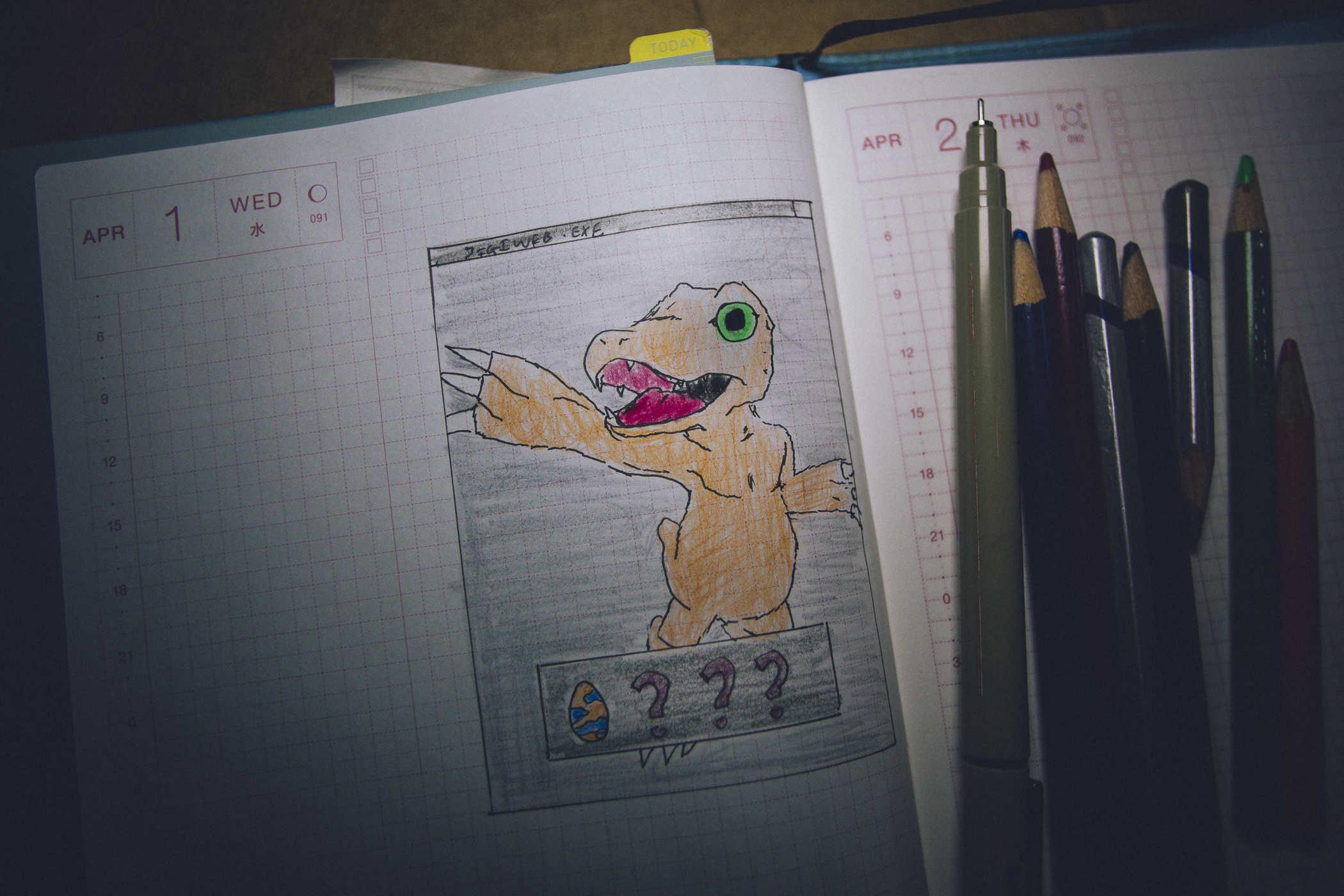Drawing of the digimon character Agumon, a yellow/orange therapod looking dinosaur with green eyes