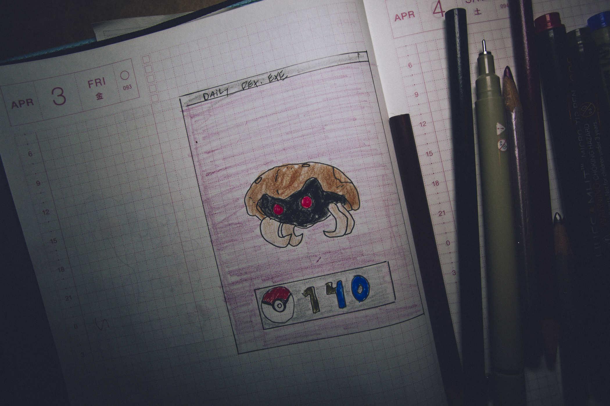 Drawing of pokemon 140; a small red eyed bug looking creature