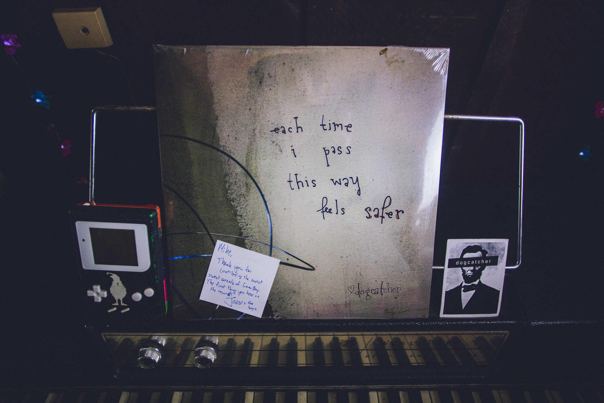 Photo of a vinyl record with the words 'each time i pass this way feels safer