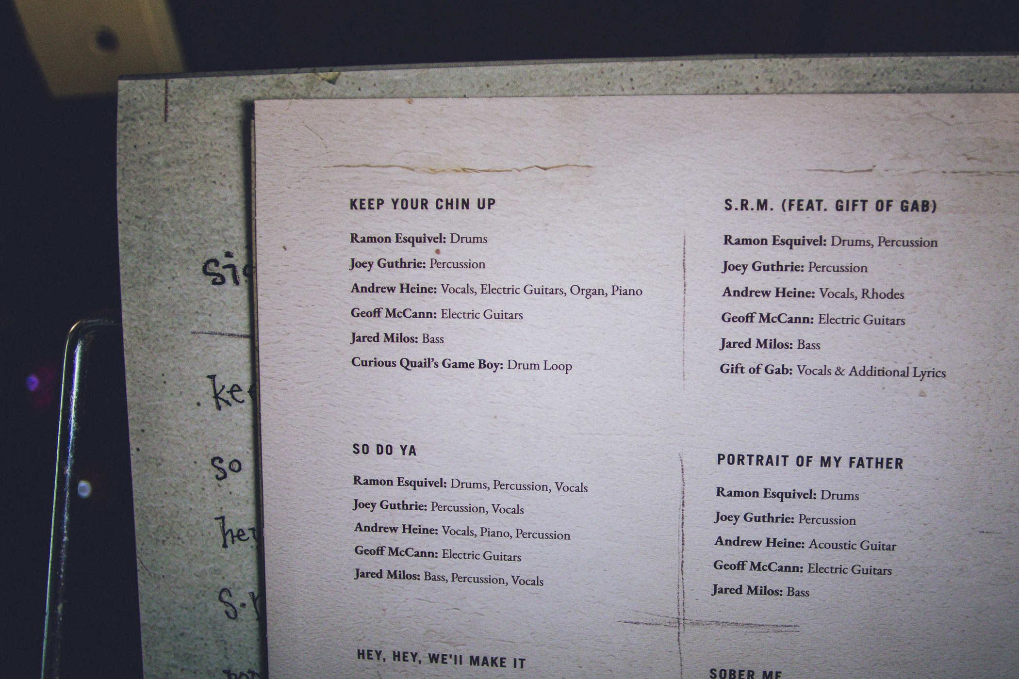 Back cover of the record with track listing and personnel; KEEP YOUR CHIN UP features Ramon Esquivel: Drums
Joey Guthrie: Percussion
Andrew Heine: Vocals, Electric Guitars, Organ, Piano
Geoff McCann: Electric Guitars
Jared Milos: Bass
Curious Quail's Game Boy: Drum Loop