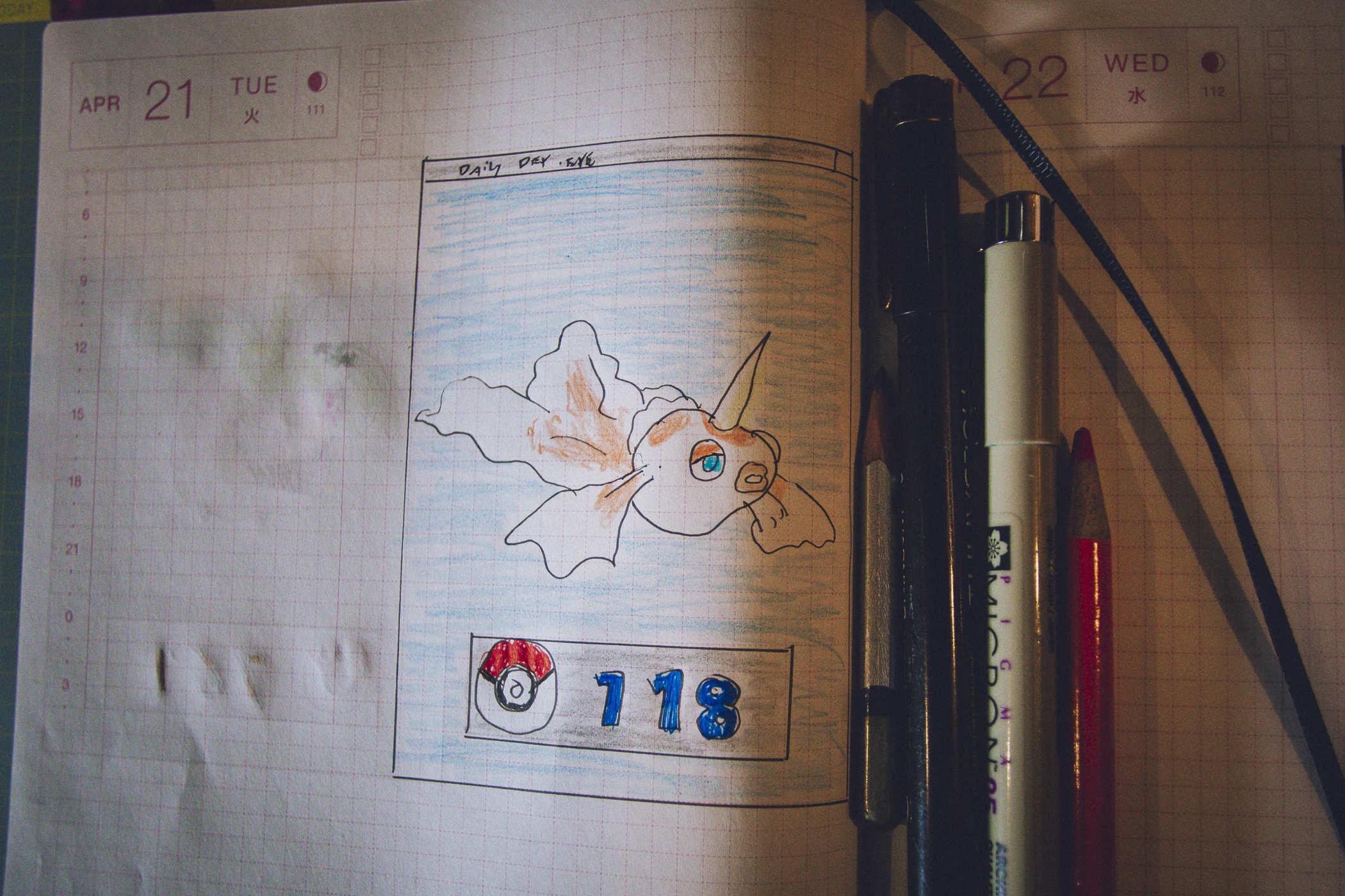 Drawing of pokemon 118; a goldfish with a unicorn horn