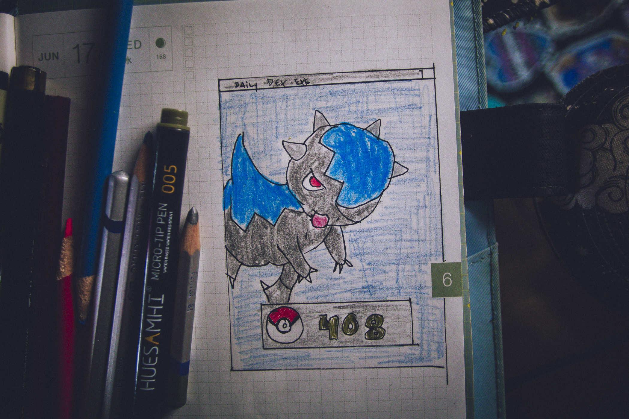 Drawing of pokemon 408; a blueish grey dinosaur with a head that appears to be a battering ram much like a pachycephalosaurus
