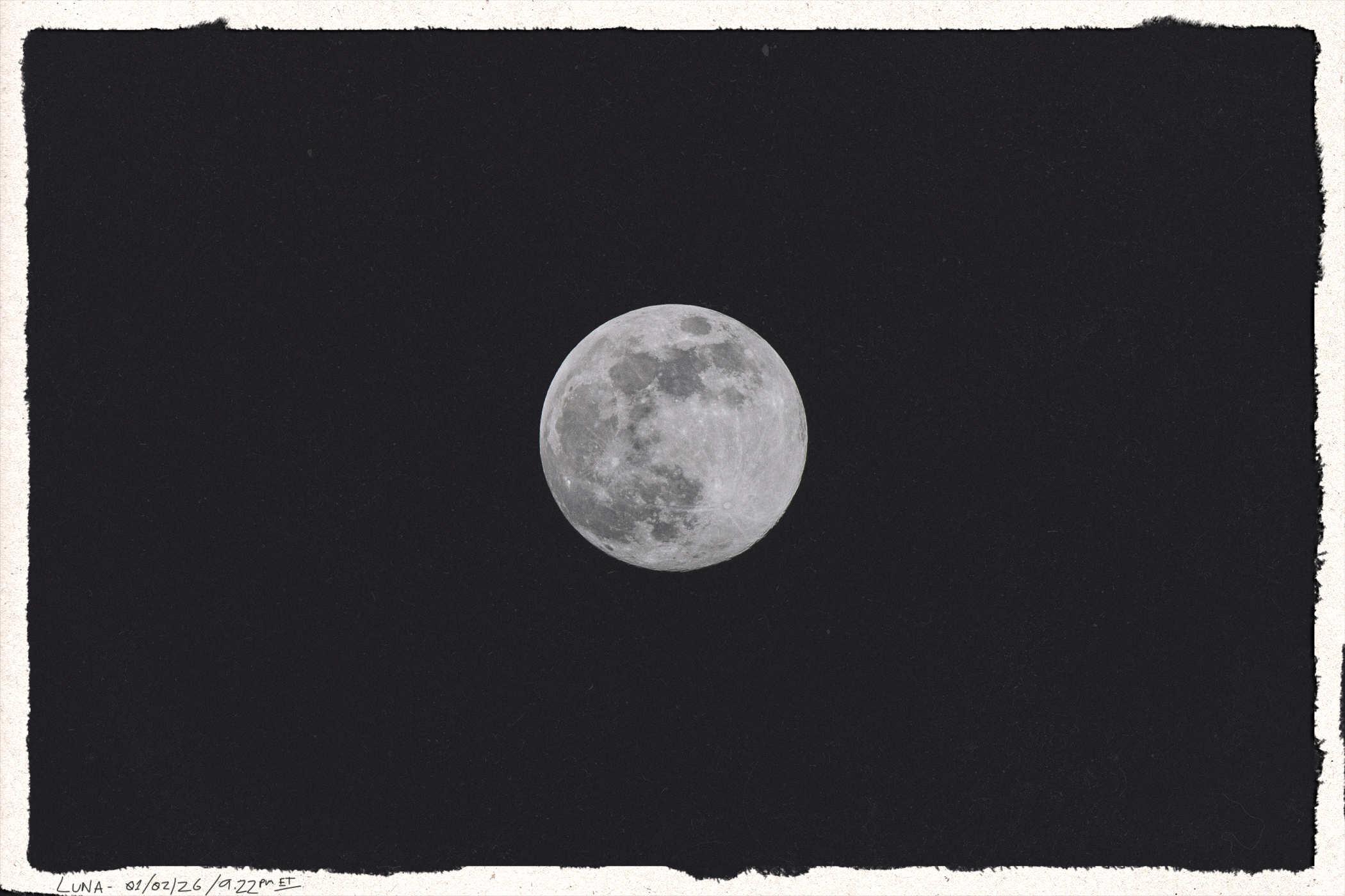 Framed photo of the moon, full and shining in the center of the frame; handwritten in the lower left is LUNA; 01/02/2026 // 9:22pm ET