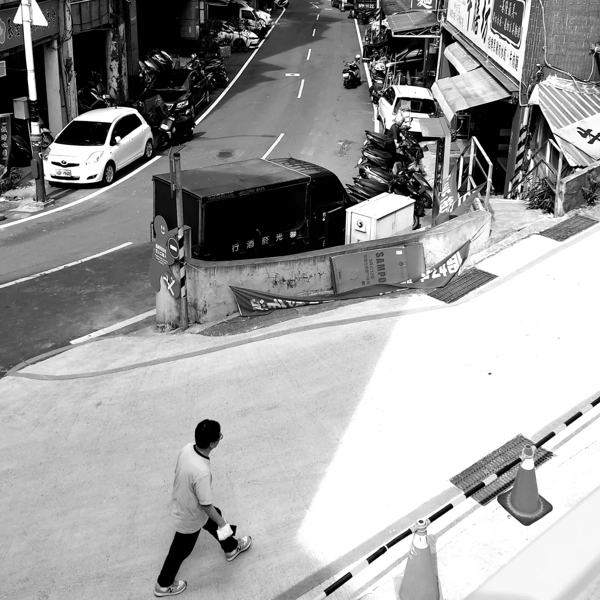 Man walking down an empty city street