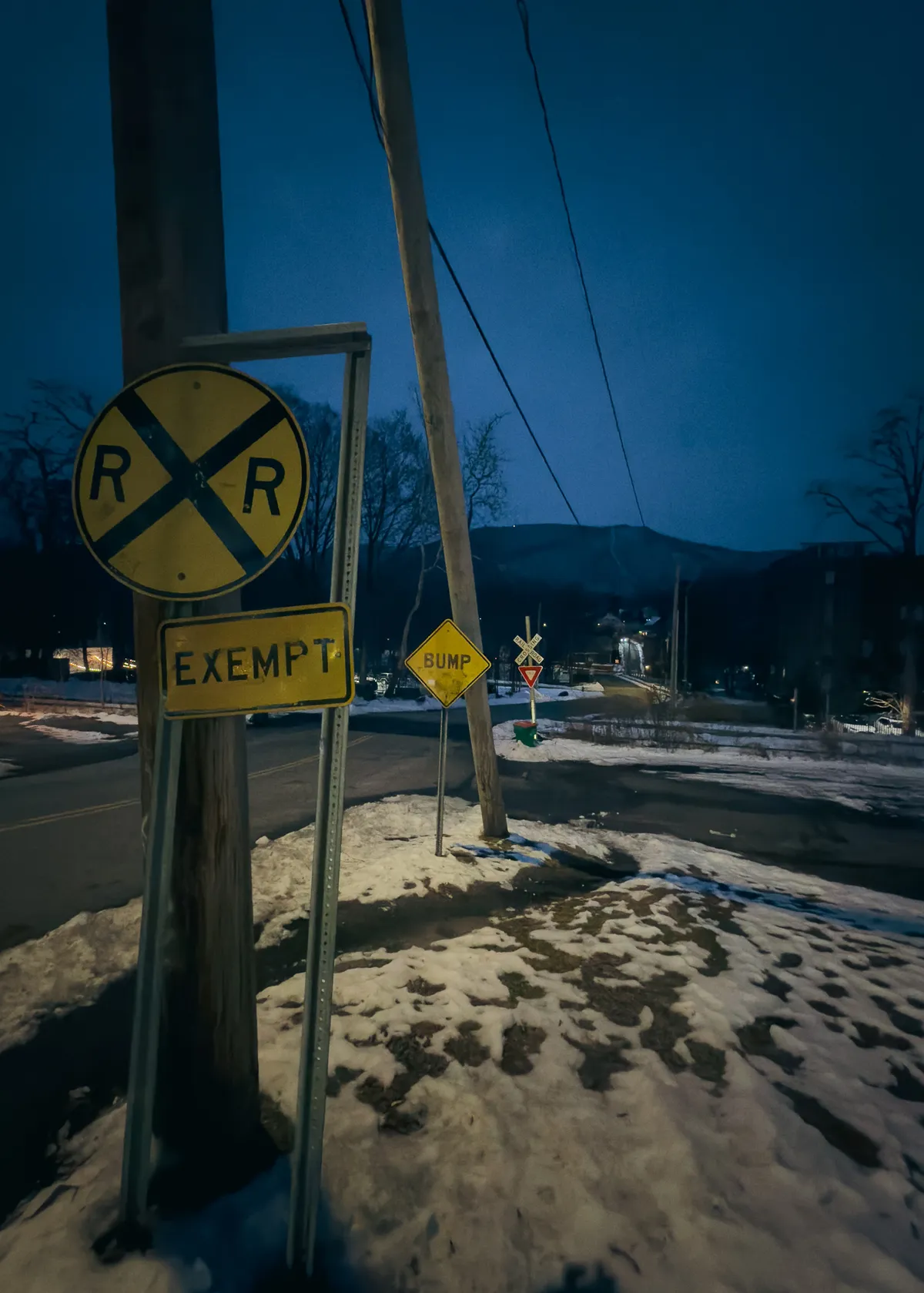 road signage with mountains in the distance 20260106-IMG_1184