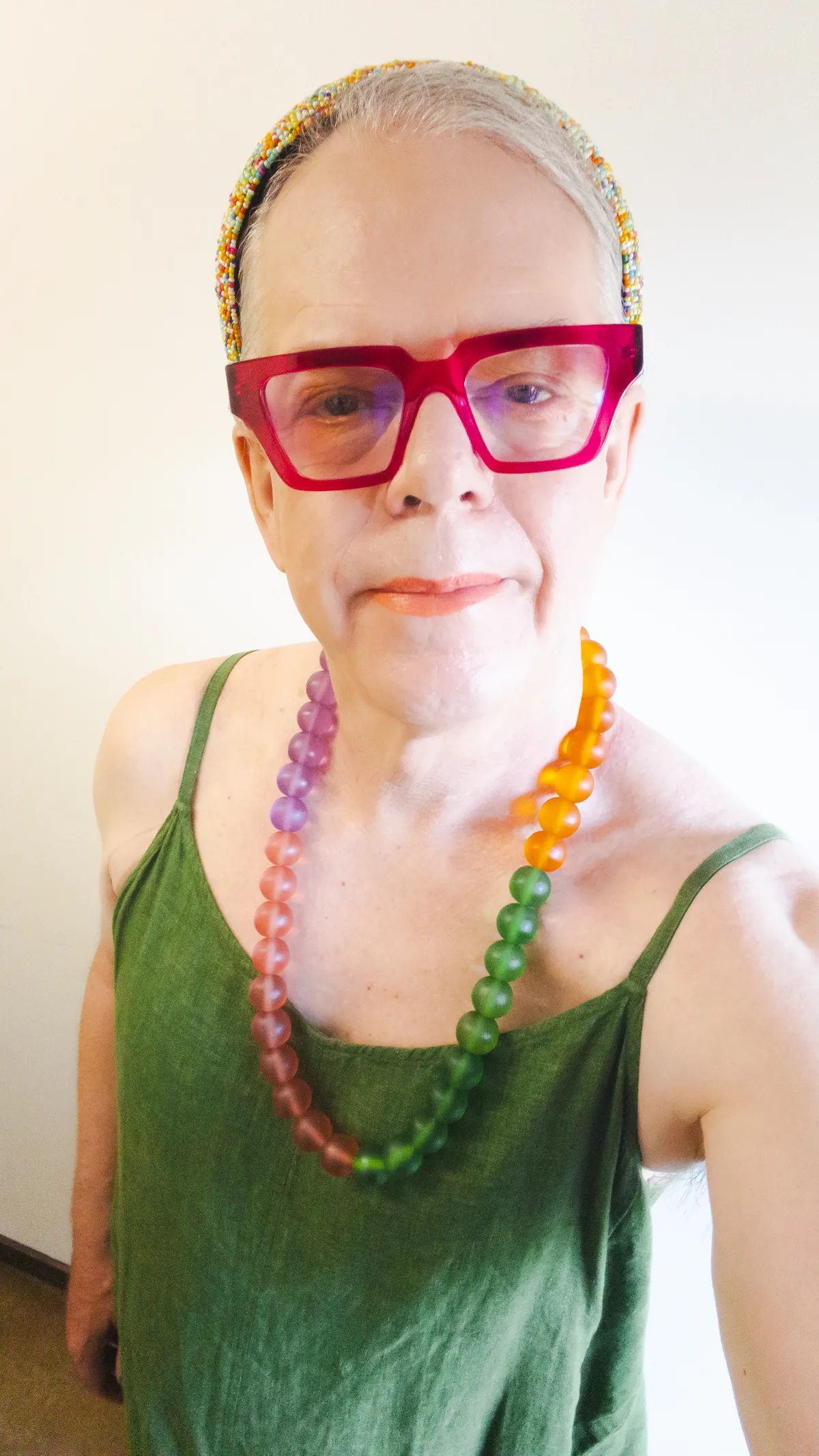 self portrait with green spaghetti strap dress, multicolored bead headband, multicolored resin bead necklace IMG_3914