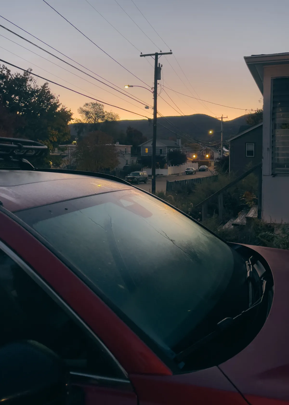 predawn photo of car in foreground and mountains, silouetted in background, cloudless skies IMG_7094