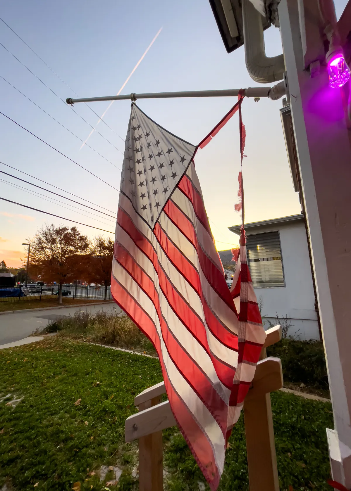 torn american flag dangling from a flagpole kriegh-05