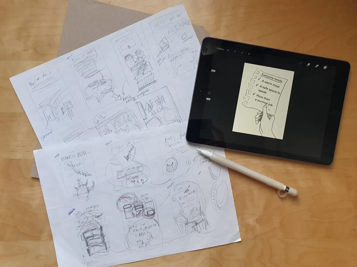 Planning zine layout and sketching on paper before proceeding with Procreate