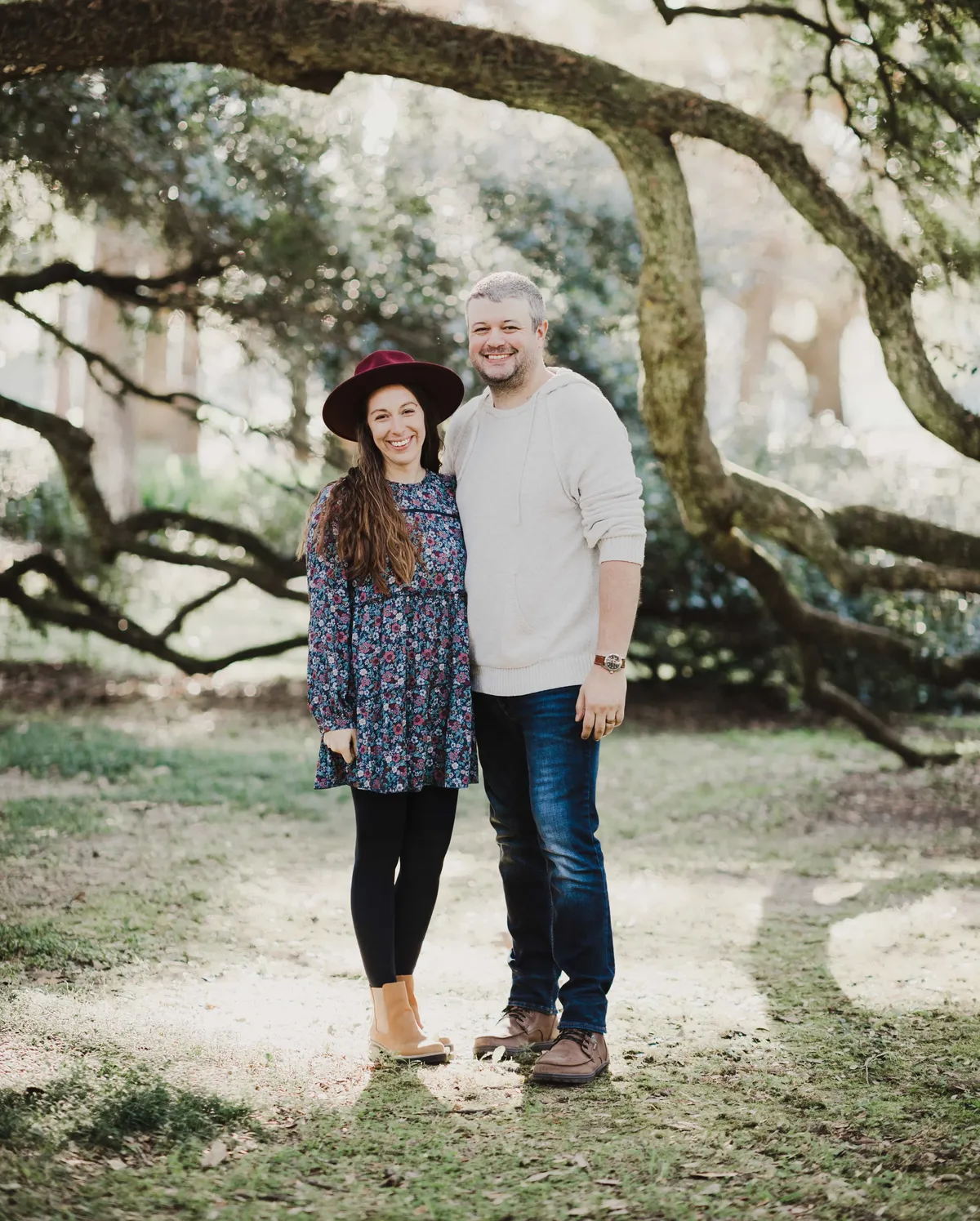 Matt and Kalena pose in front of a tree.