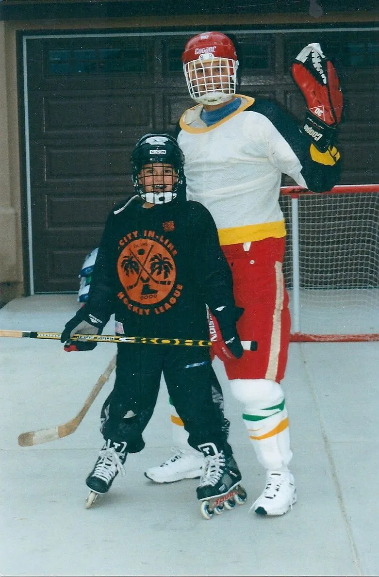 Me and my dad playing hockey on the driveway
