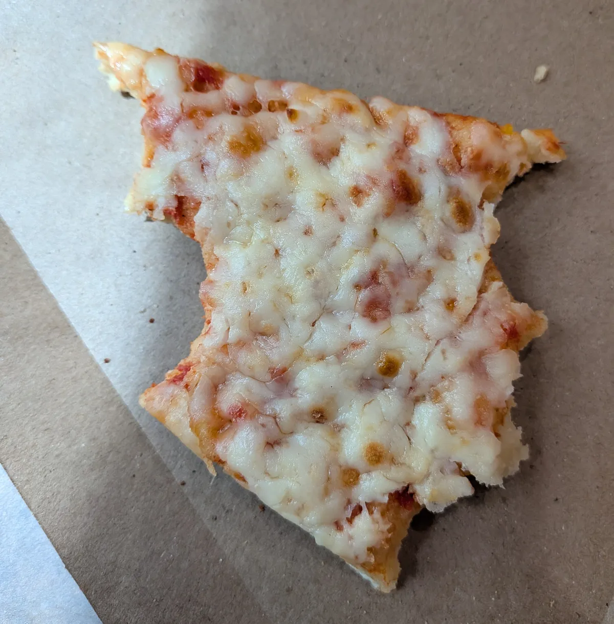 a peice of almost finished pizza.