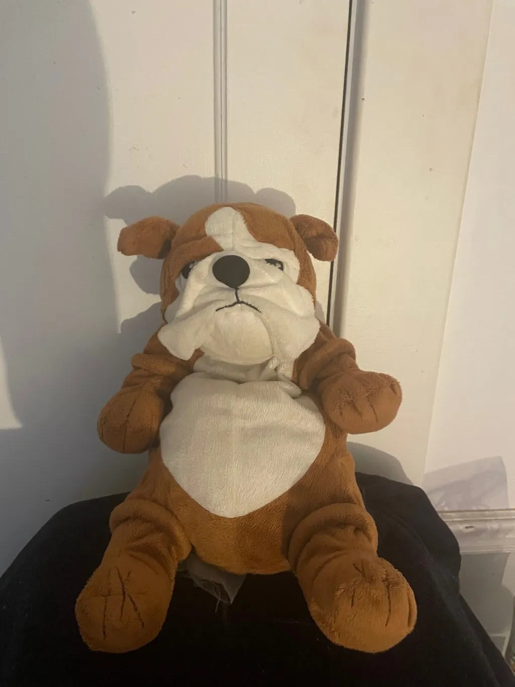 a brown and white stuffed bulldog plush