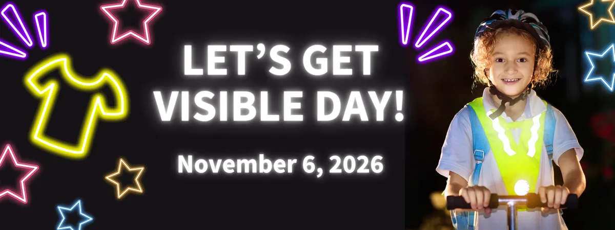A banner image from SD61 saying "Let's get visible day! November 6, 2026" on a black background, with neon shapes and an image of a kid on a kick scooter wearing a helmet incorrectly, and a reflective vest.