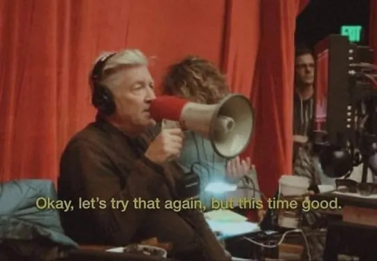 David Lynch yelling with the subtitle "Okay, let's try that again but this time good"