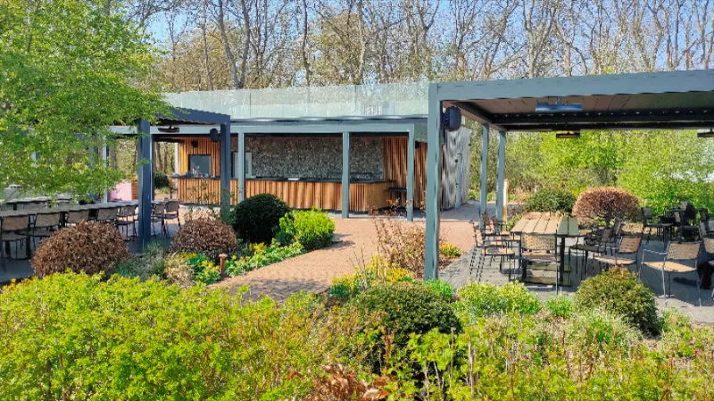 A view of some outside eating areas, and a bar