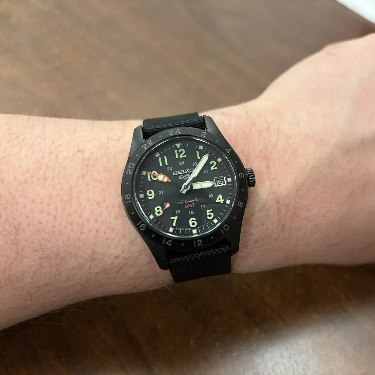 photo of a black stainless Seiko watch