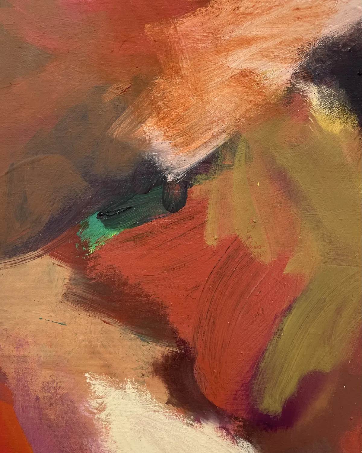 A detail shot of paint, showing layered color and strokes moving in different directions