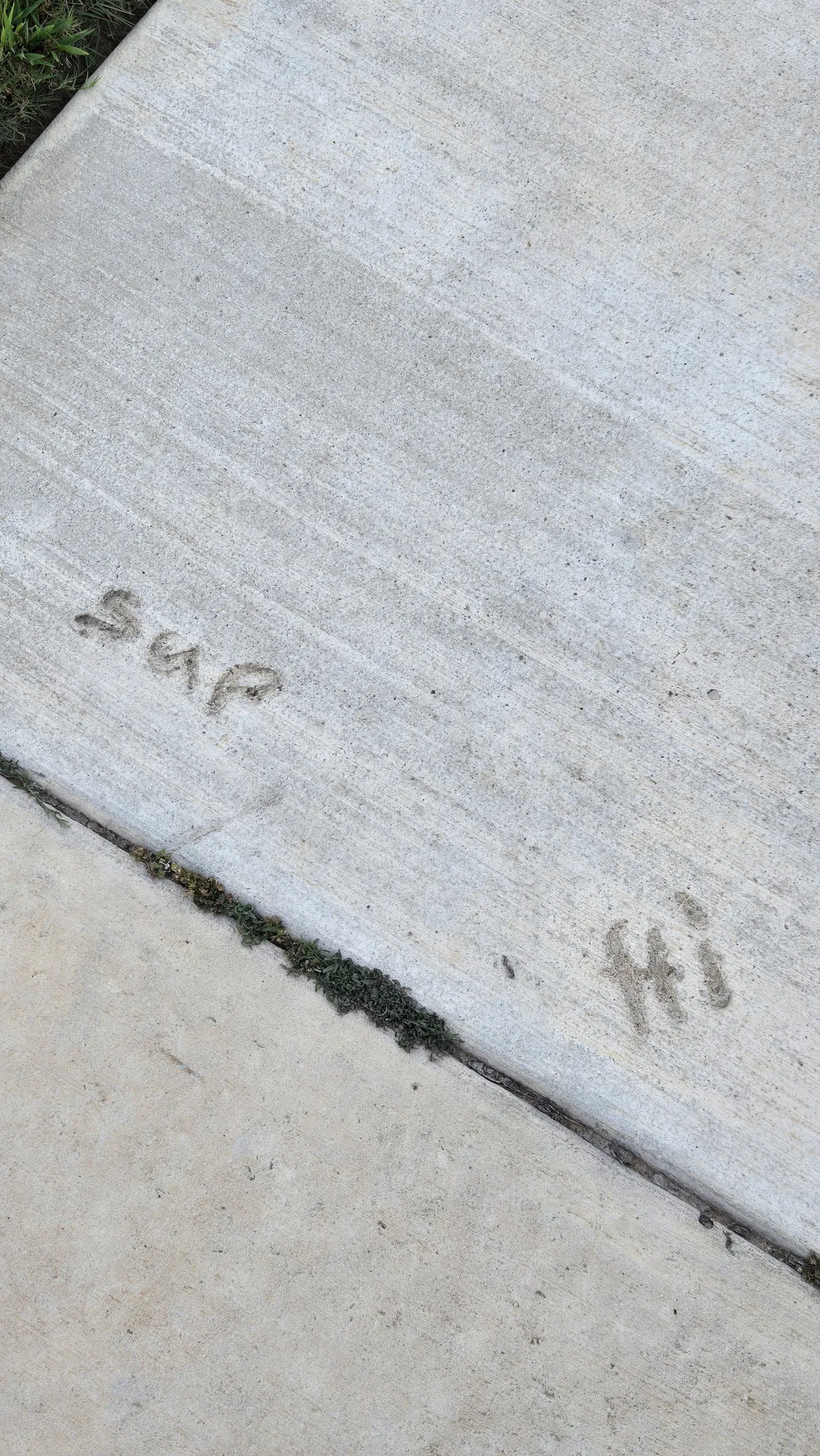 Sidewalk with writing on it