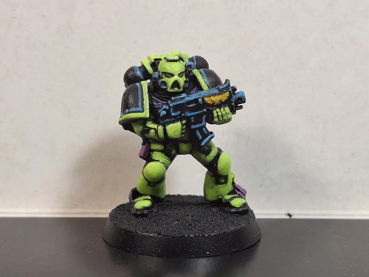 A miniature of a Space Marine in a garish color scheme.