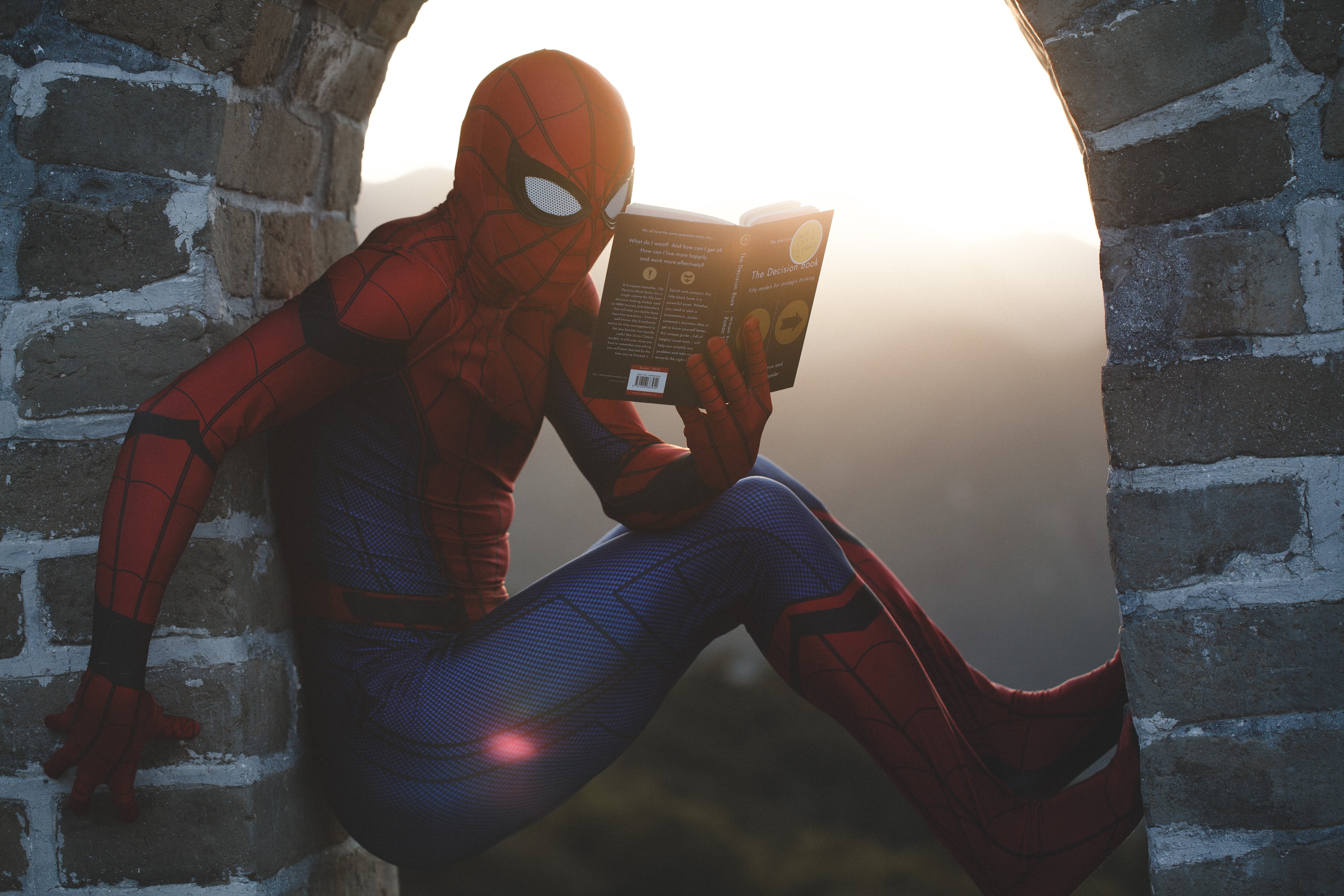Spider-Man, reading a book