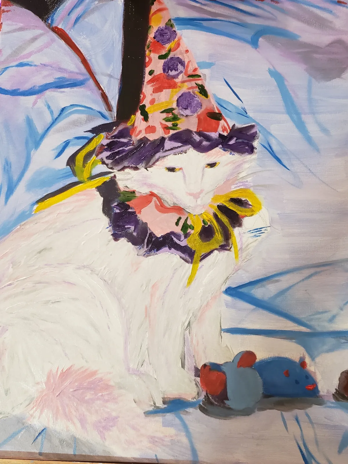 A traditional acrylic painting of a white cat wearing a colourful clown hat and a frilled piece of fabric on its neck. The cat looks displeased. There's a toy mouse by its feet.