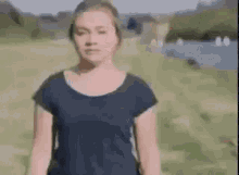 A scene from midsommar where Dani is walking away crying, but it's been manipulated in such a way that Dani's body gets squished strangely and hilariously the further she walks.