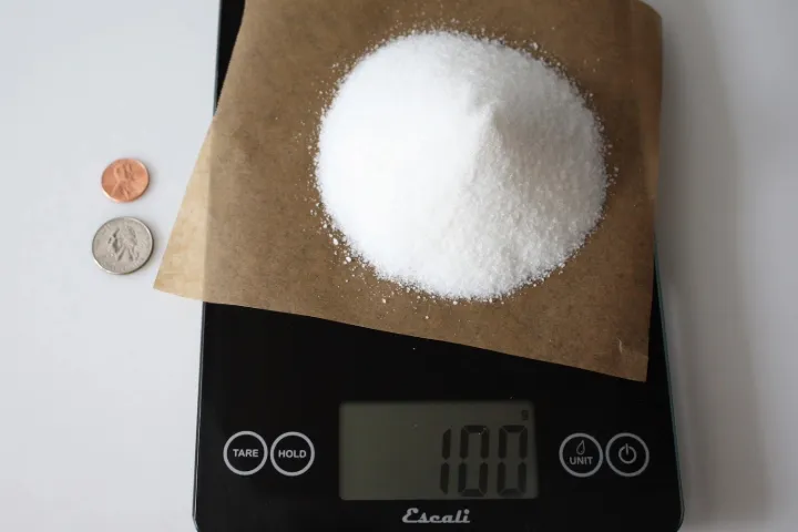 100 grams of sugar on a scale