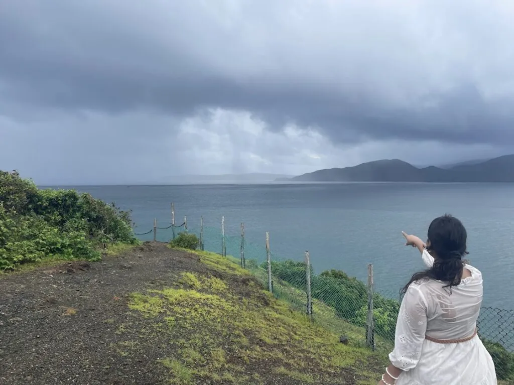 Distant clouds pouring into the sea