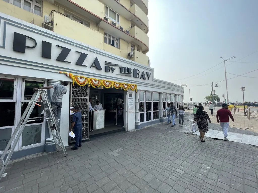 The entrance to Pizza by the Bay, facing the Marine Drive