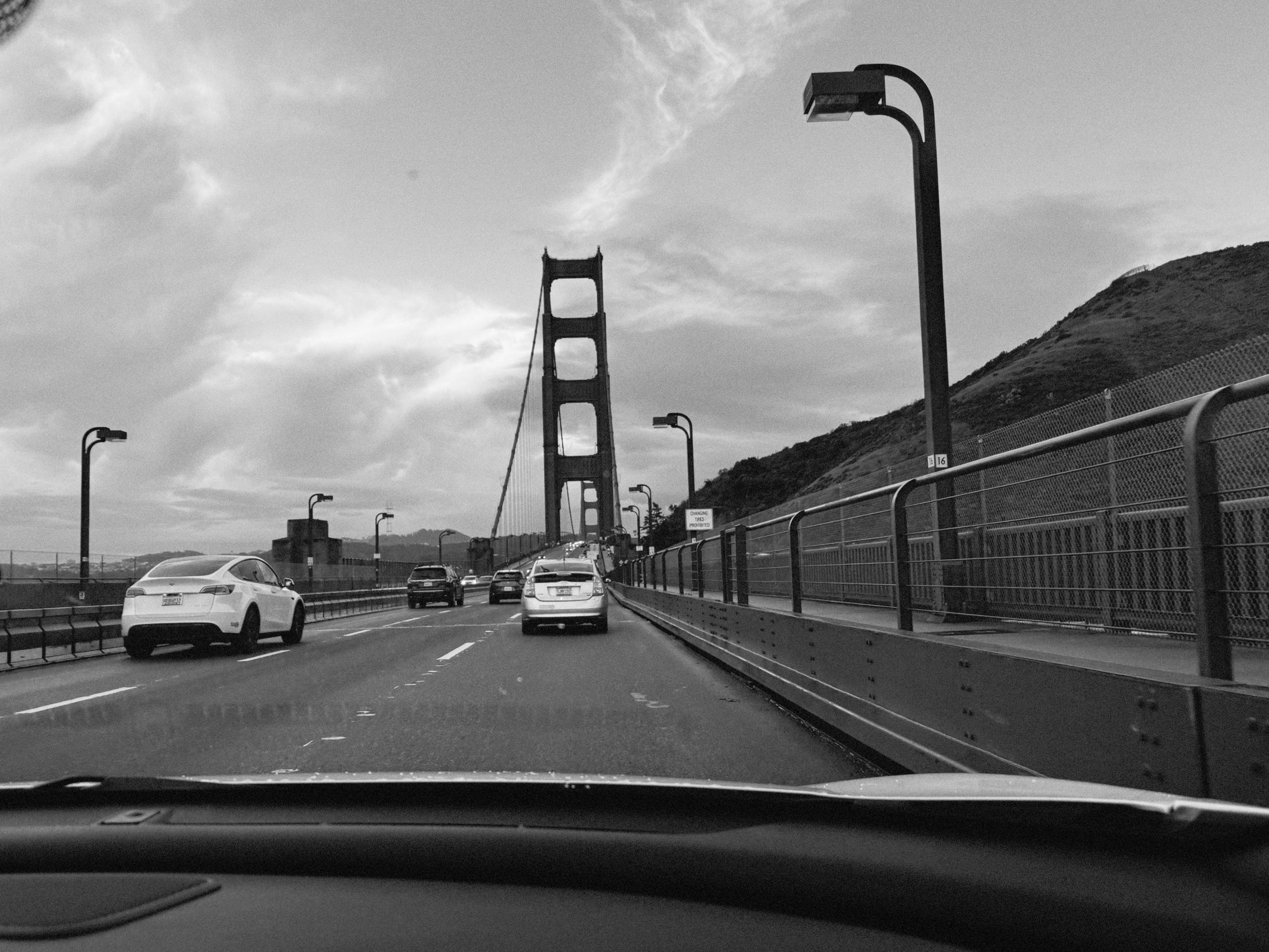 Golden Gate Bridge from a car in black and white