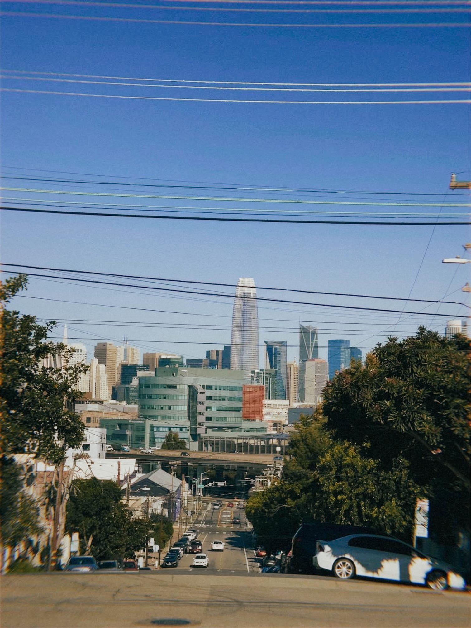 City street leading into the San Francisco skyline