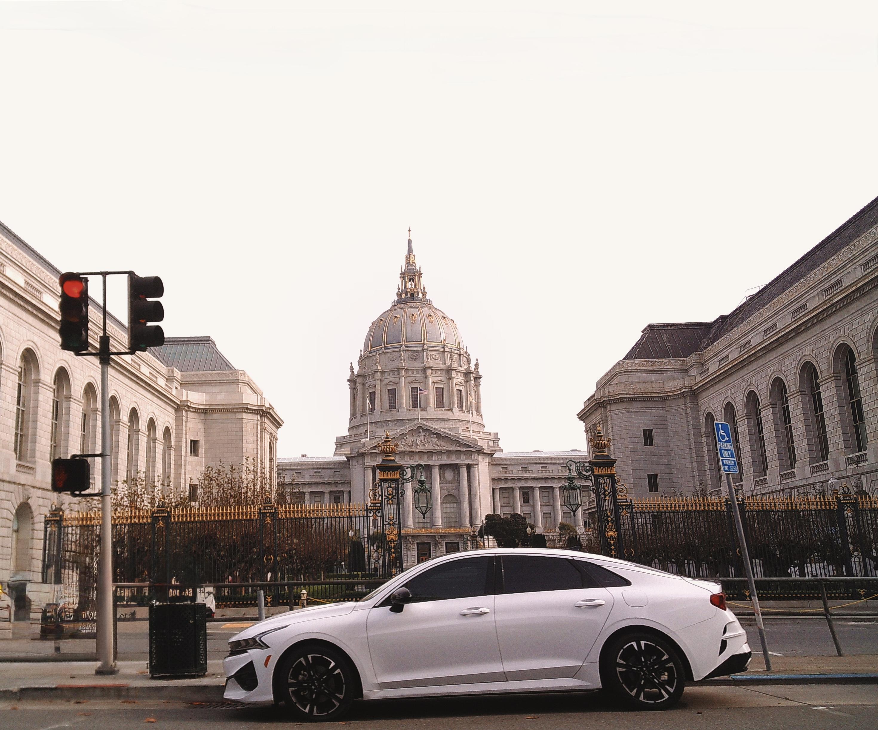 San Francisco Civic Center with a white car parked in front of it