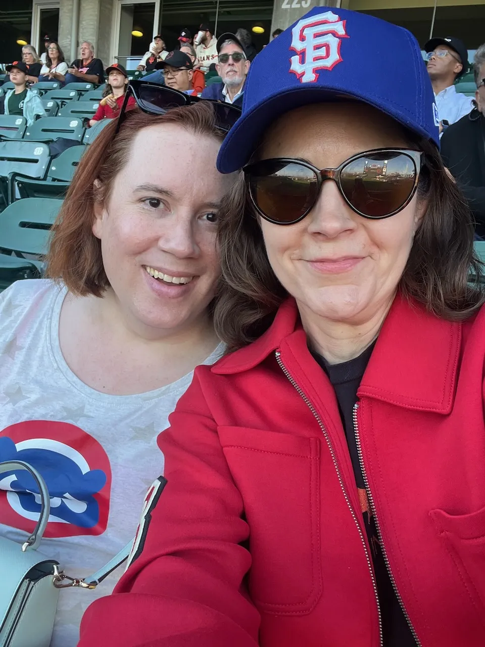 Two women taking a selfie at a base game