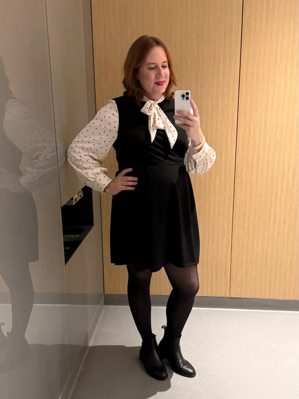 A woman posing for a selfie in a bathroom