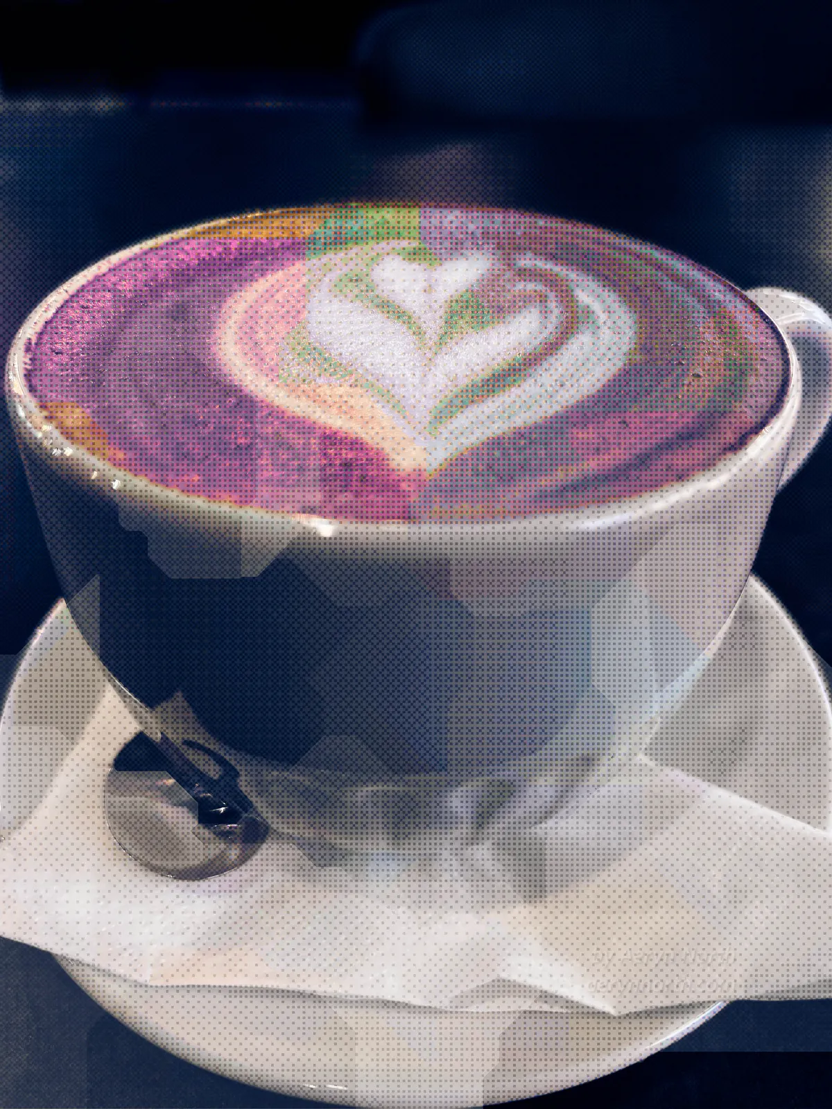 Photo glitch art of a mug of latte