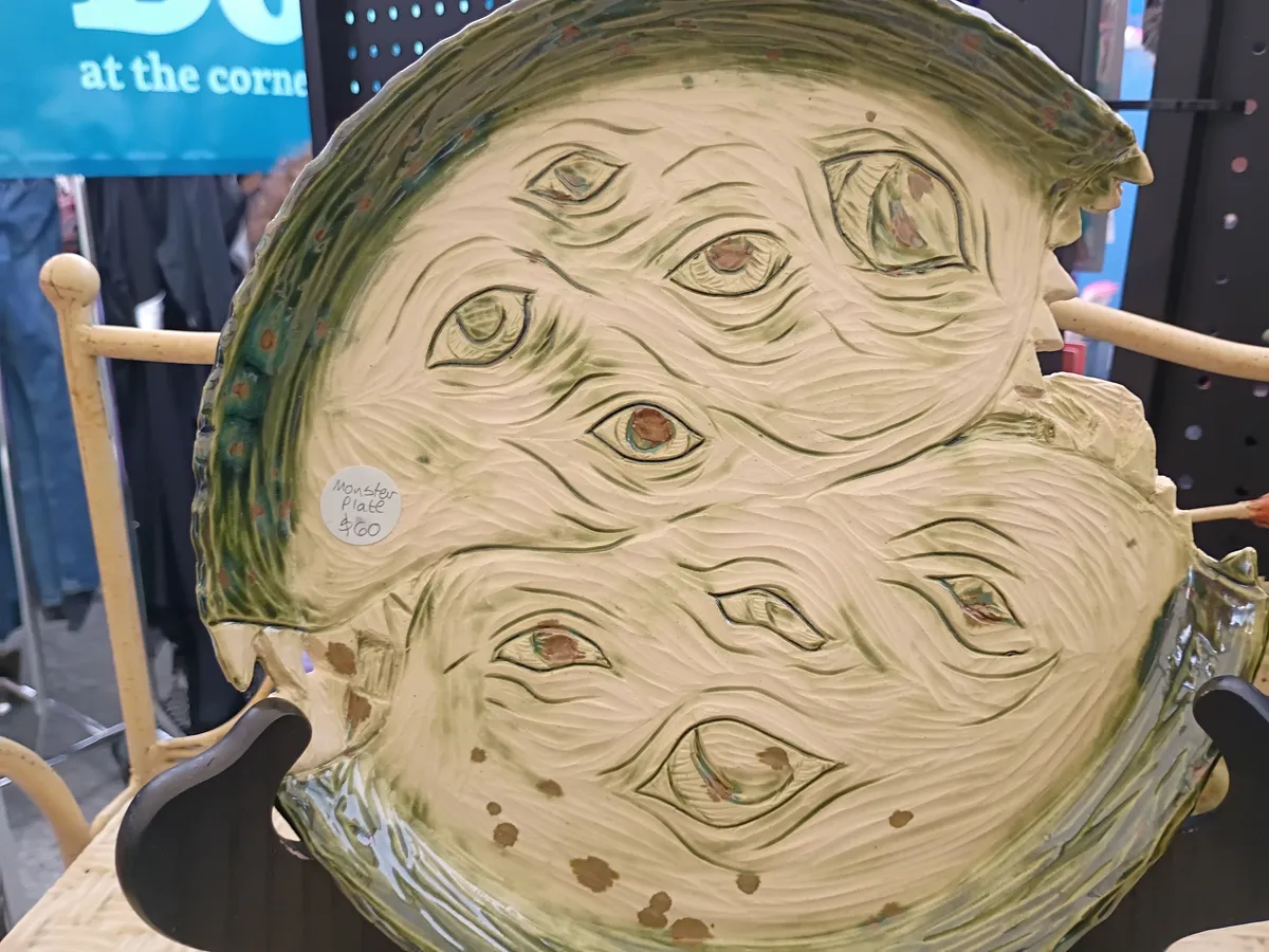 a handmade plate with monster eyes