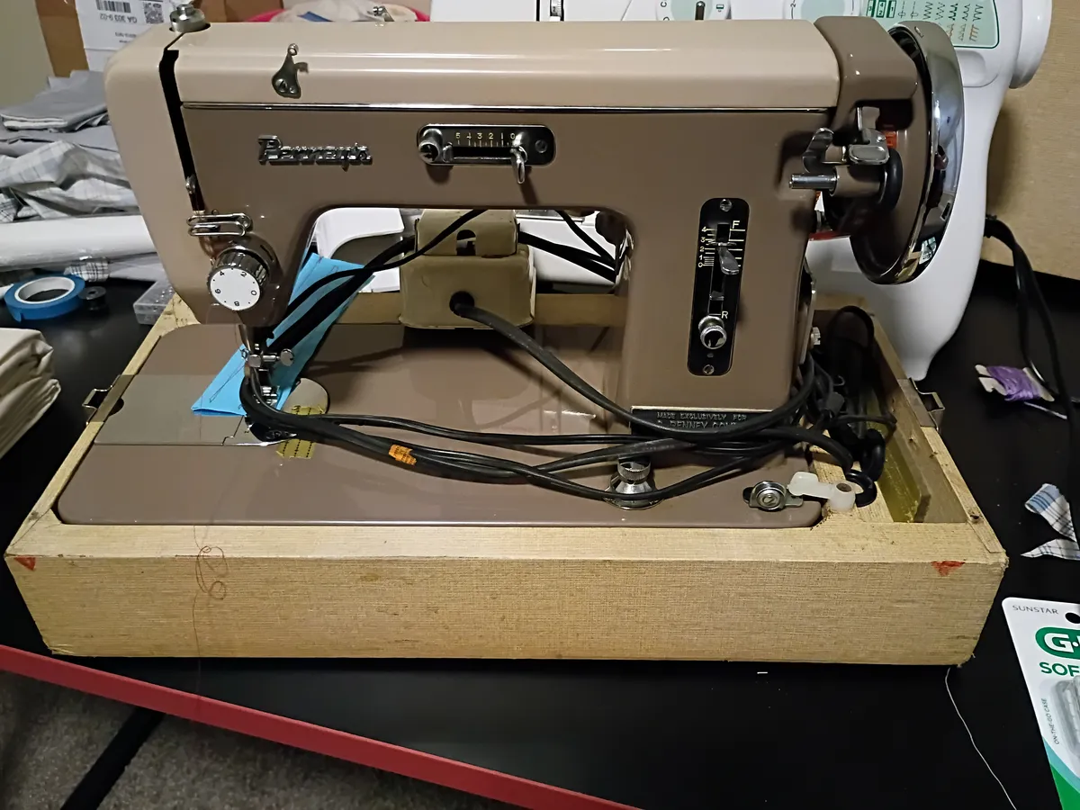JCPenny 610 vintage sewing machine, an electric sewing machine with a brown metal body