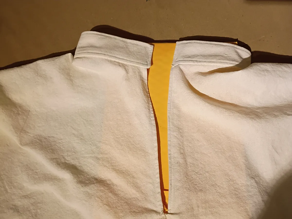 simple band collar attached to a shirt made with undyed cotton fabric
