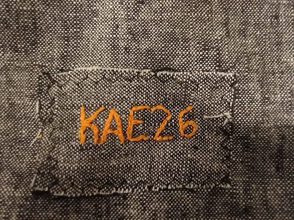 hand emboridered clothing tag: kae '26