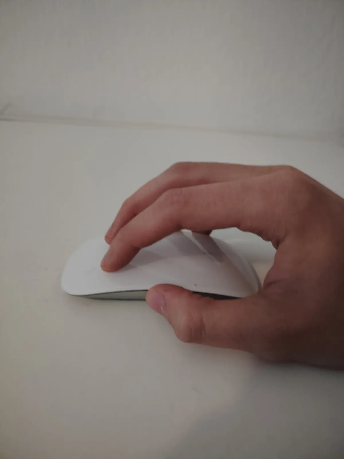 A picture of yours truly using an apple mouse.
