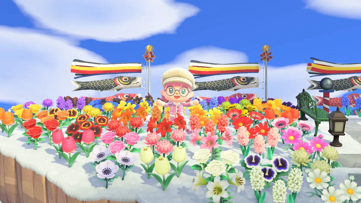 Slothra is surrounded by a rainbow of flowers, with carp streamers in the background.