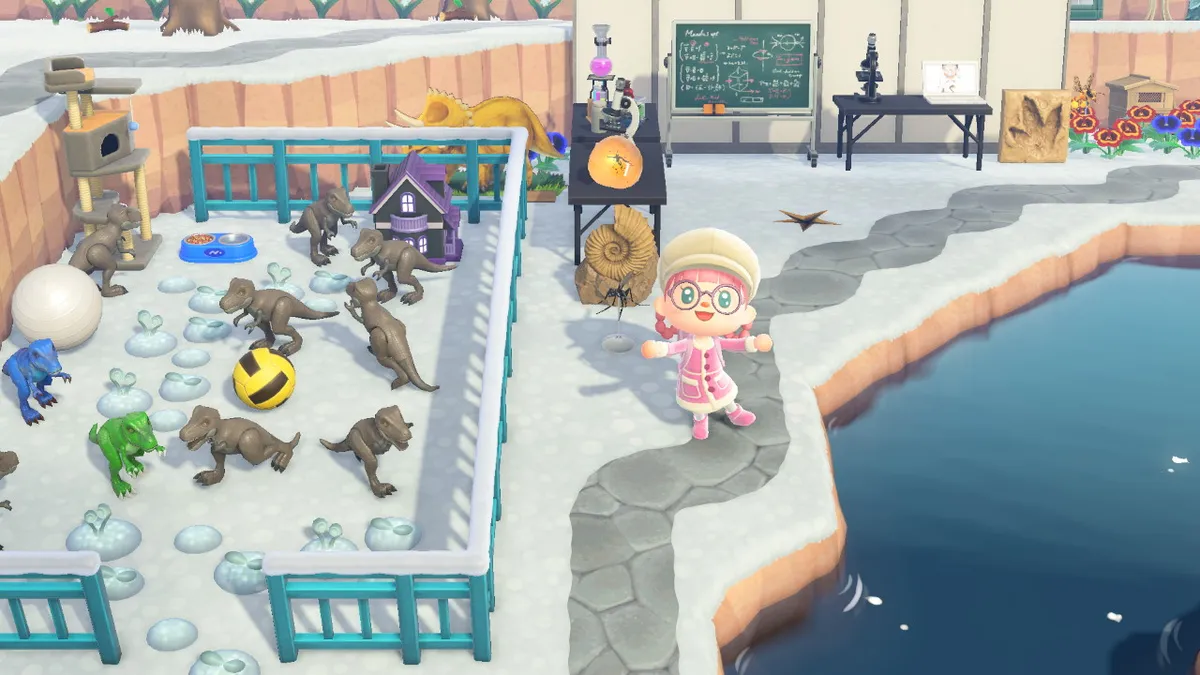 Slothra is standing next to a fenced-off area with plastic tyrannosaurus rexes, who have balls, toys, and plants for enrichment. Behind them is a small science lab, with amber, microscopes, chemistry sets, and a laptop with Nedry going "Nah-ah-ah"