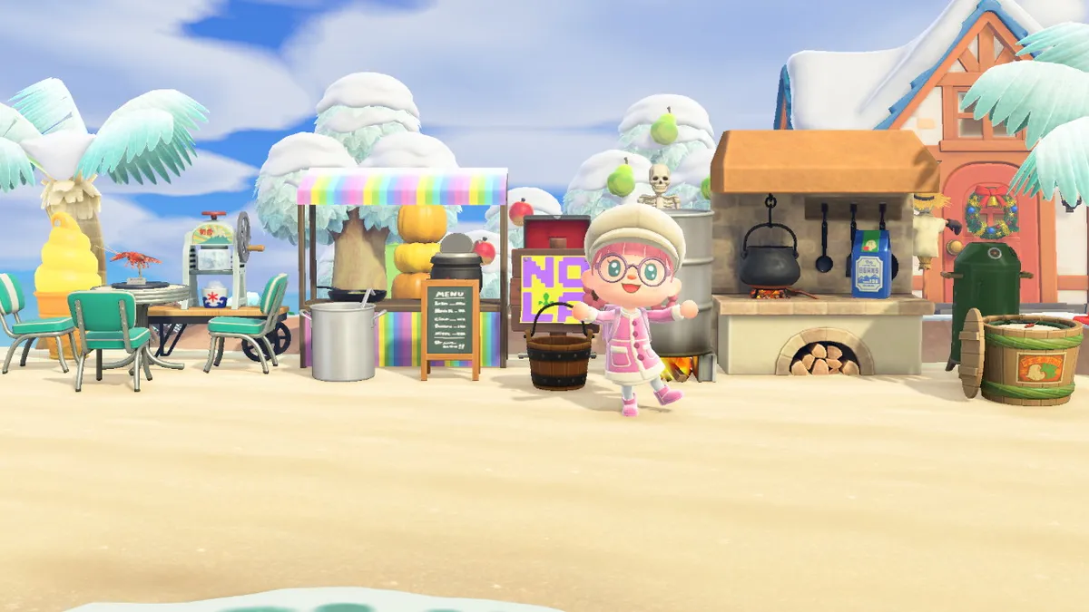 Slothra is standing in front of a collection of stuff to make it a restaurant, with a kitchen, a smoker, a booth, a table with chairs, and a giant pot.