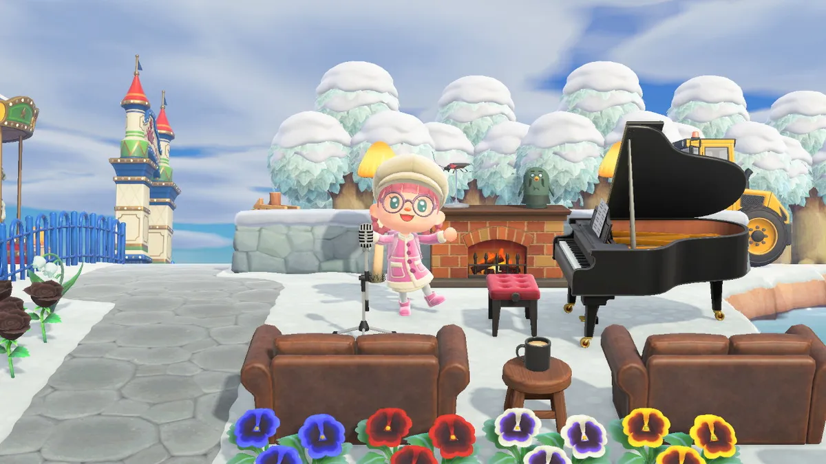 Slothra is standing next to a grand piano, with a fireplace in the background, a microphone in front of them, and two leather sofas in front of that